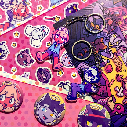 A Purrfect Apawcalypse Big Dog Merch Bundle made up of two sticker sheets, two keychains, a button set and a mini print.